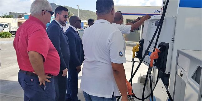 In the photo from the left are Sol Petroleum General Manager for the North Caribbean David Antrobus, Minister of TEATT the honorable Stuart Johnson, Member of Parliament for the National Alliance Egbert Jurendy Doran, and members of the Department of Inspection in the Ministry of TEATT at a Sol Gas Station inspecting the Gas Pumps to ensure that they are accurately calibrated for the dispensing of fuel. 