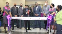 Senator the Honourable Rohan Sinanan, Trinidad &amp; Tobago Minister of Works and Transport, cuts the ribbon at the departure gate to flight BW 414 along with Caribbean Airlines Board Members and CEO, Garvin Madera.