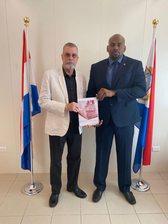 L - R: SZV Director Glen A. Carty presented the draft 2023 budget to the Minister of VSA, Omar Ottley on March 31, 2022. 