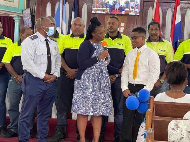 Minister of Justice Anna E. Richardson and members of KPSM making a special presentation to Keenan Benjamin.